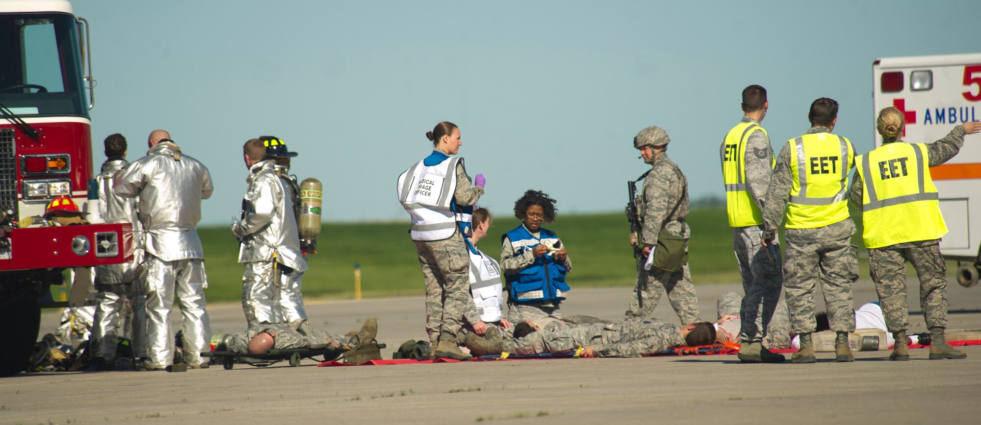 Airmen from the 5th Bomb Wing participate in a mass causality exercise at Minot Air Force Base, N.D., June 27, 2013. The purpose of the exercise is to evaluate and validate the 5th BW’s emergency management capabilities and testing first responders and medical personnel on their ability to quickly and effectively respond to a catastrophic event.  (U.S. Air Force photos/Senior Airman Brittany Y. Auld)
