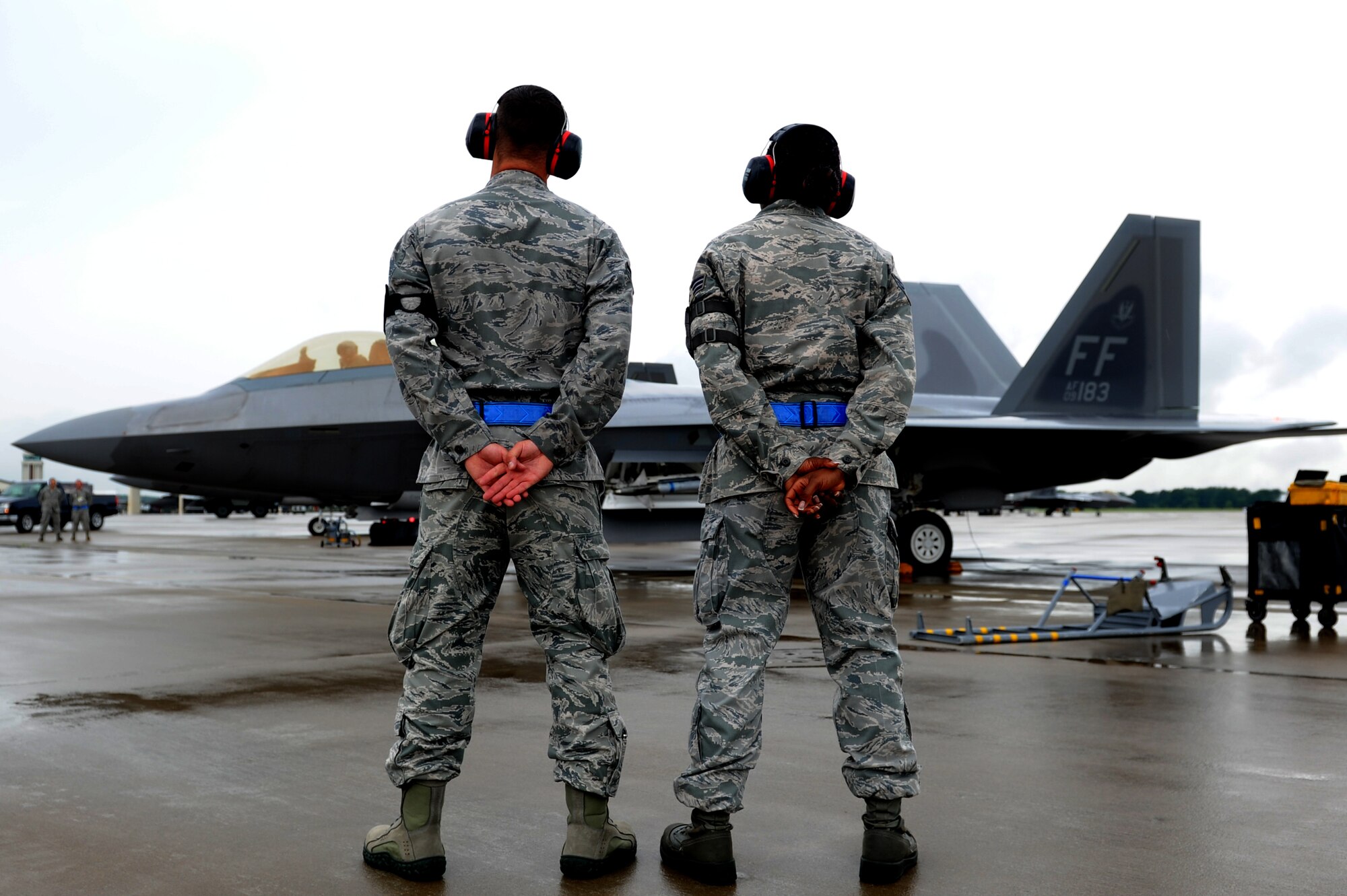 Airmen from the 1st Fighter Wing await the “fini flight” departure of Col. Kevin J. Robbins, 1st FW commander, at Langley Air Force Base, Va., July 12, 2013. During his career, Robbins served in various capacities in six fighter wings, commanding at the flight, squadron and wing levels. (U.S. Air Force photo by Airman 1st Class Kimberly Nagle/Released)