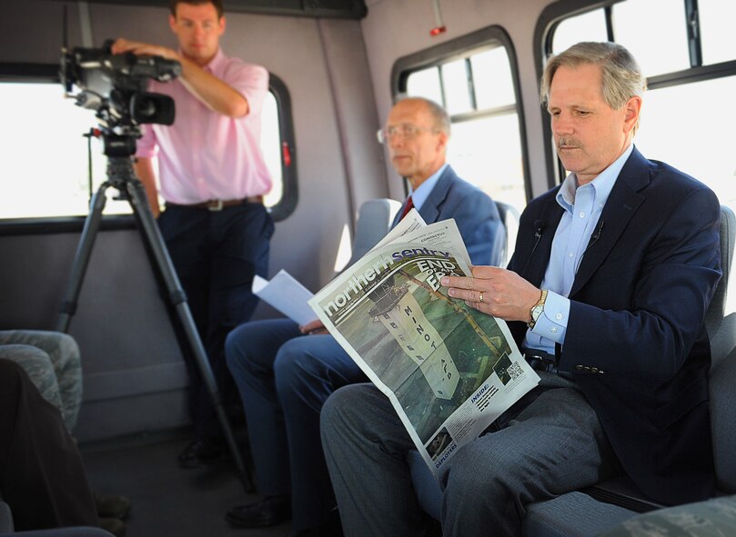 North Dakota Senator John Hoeven reads a past edition of the Northern Sentry during his recent visit to Minot Air Force Base, N.D., July 3, 2013. He visited the base to tour all current construction efforts and infrastructure enhancements occurring here. (U.S. Air Force photo/2nd Lt.  Jose Davis)