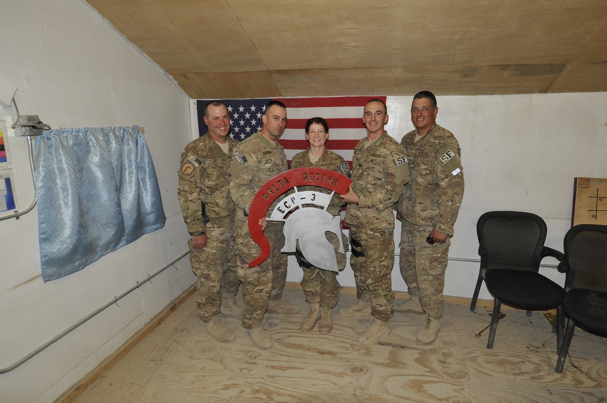 (left to right) Master Sgt. Joshua Clarke, Tech. Sgt. Eric Wearing, Airman 1st Class Tina Venable, Capt. Andrew York and Staff Sgt. Joshua Gary, 455 Expeditionary Security Force Squadron members stand together in their compound on Bagram Airfield, Afghanistan. The members were subject to an Indirect Fire attack last month, where they provided medical care to injured and defended the perimeter (U.S Air Force photo/ Staff Sgt. Stephenie Wade)