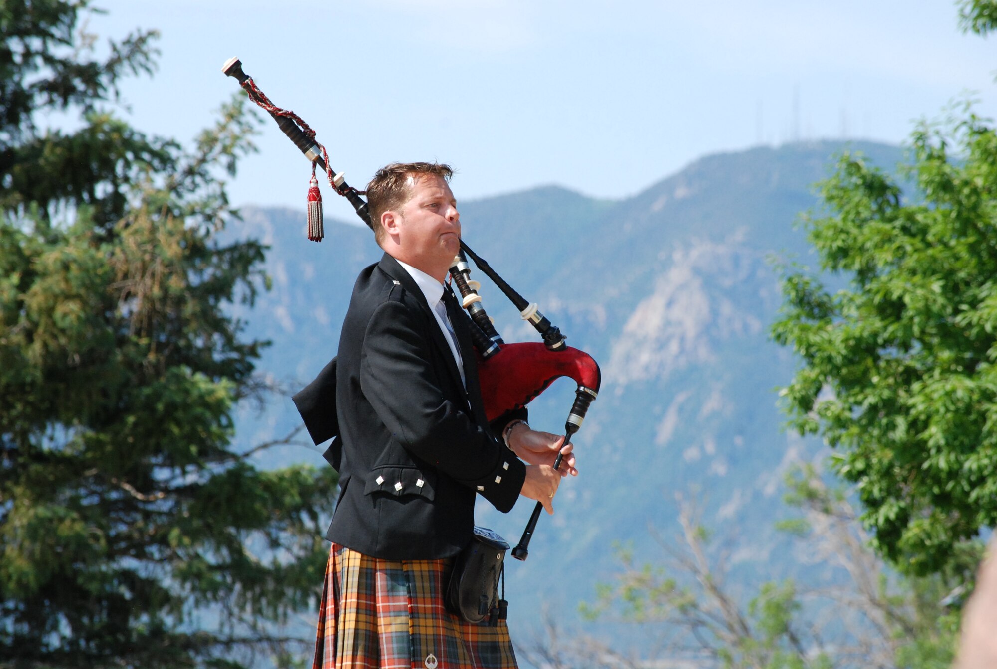 COLORADO SPRINGS, Colo. – A bagpipe player bellows out Amazing Grace July 5 as seven fallen service member’s names and stories are read aloud. The ceremony marks the first time that modern day Tactical Air Control Party members will be honored alongside their Vietnam War era predecessors in Colorado Springs. (U.S. Air Force photo/Michael Golembesky)