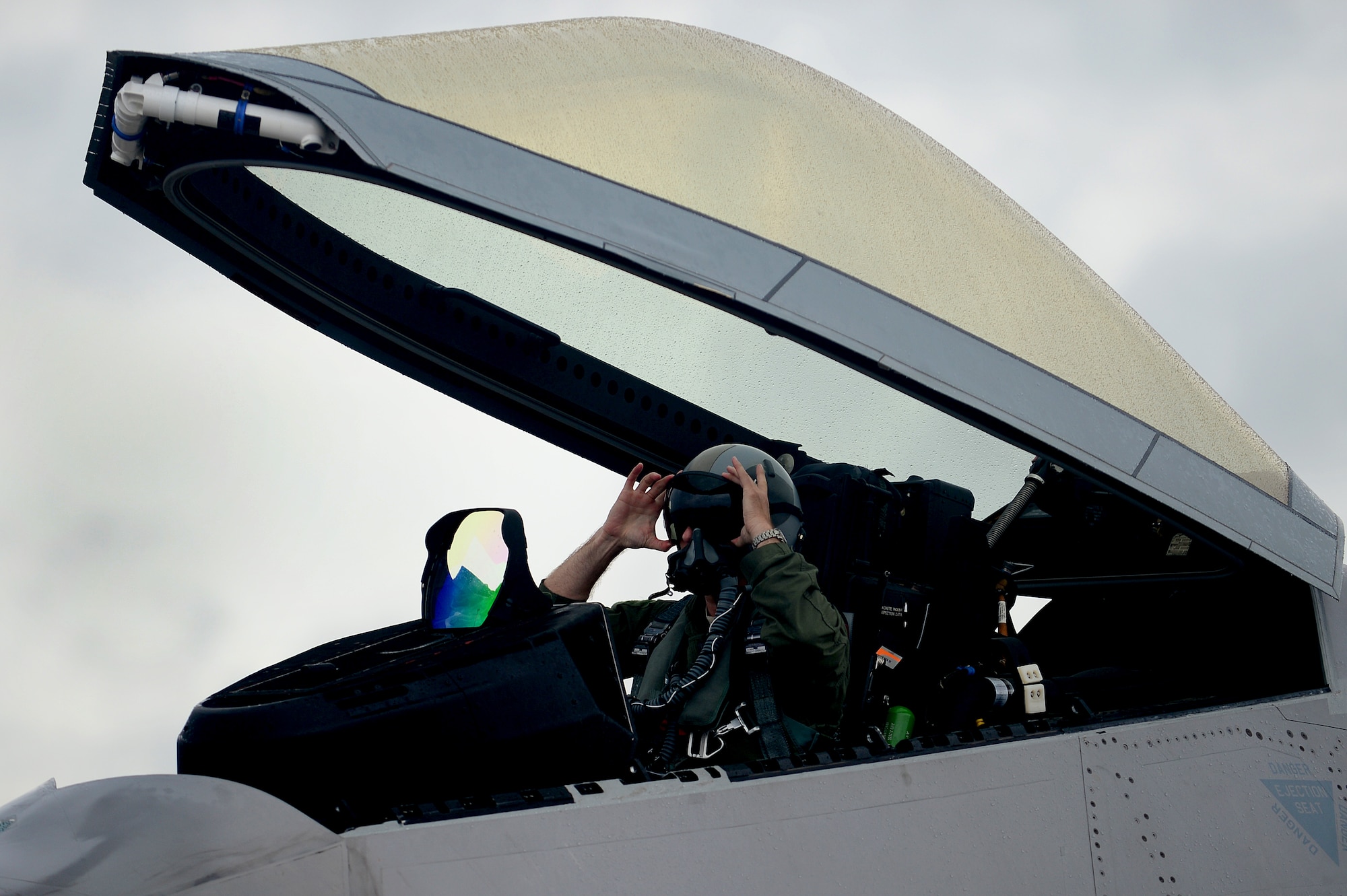 U.S. Air Force Col. Kevin J. Robbins, 1st Fighter Wing commander, prepares for his “fini flight” at Langley Air Force Base, Va., July 12, 2013. Robbins is a command pilot with more than 3,600 flight hours in the F-22 Raptor, F-15 Strike Eagle and F-16 Fighting Falcon, and has flown over 250 combat hours. (U.S. Air Force photo by Senior Airman Kayla Newman/Released)