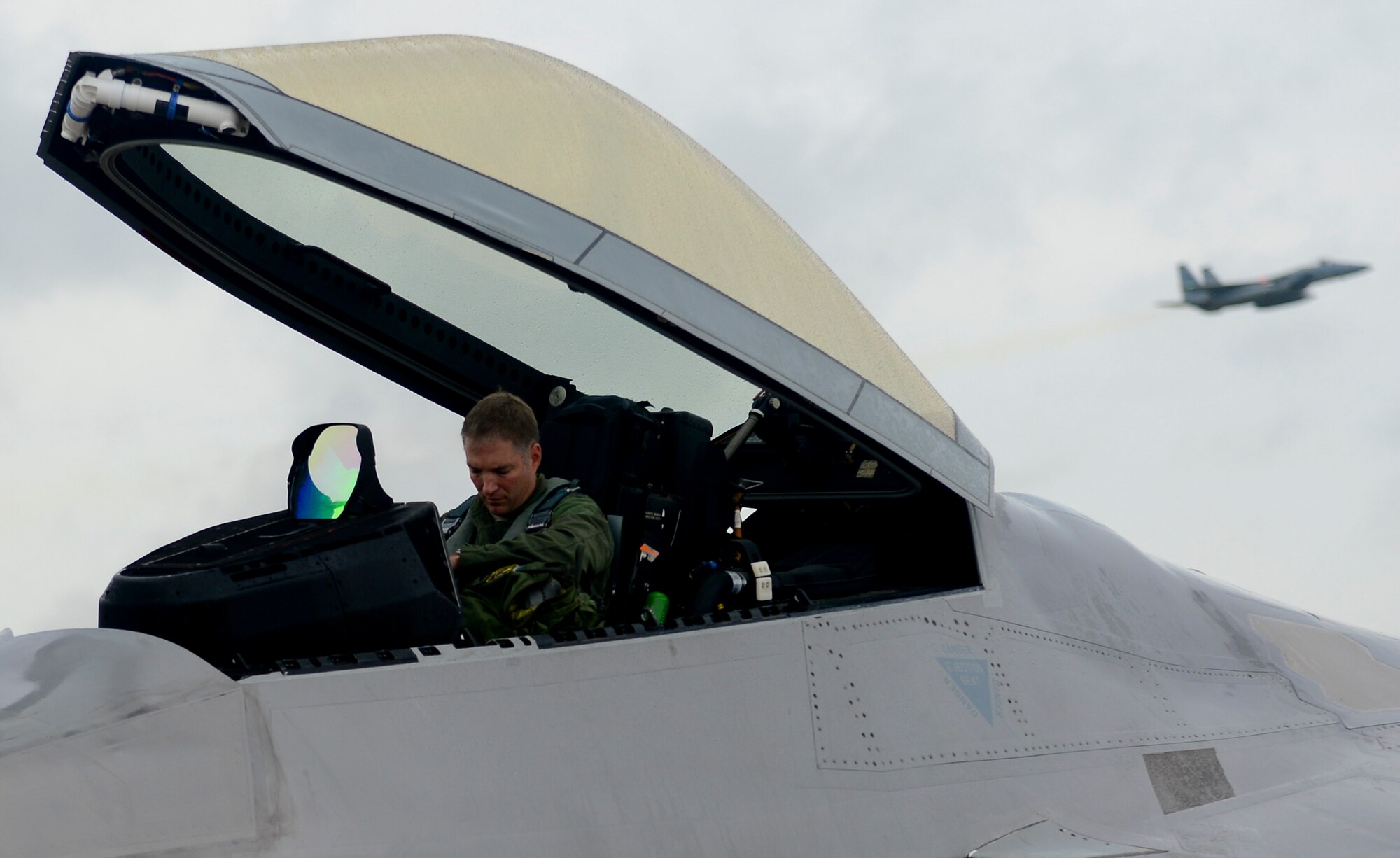 U.S. Air Force Col. Kevin J. Robbins, 1st Fighter Wing Commander, prepares for his “fini flight” at Langley Air Force Base, Va., July 12, 2013. The “fini flight” is an Air Force tradition which can be traced back to the Vietnam War. (U.S. Air Force photo by Senior Airman Kayla Newman/Released)