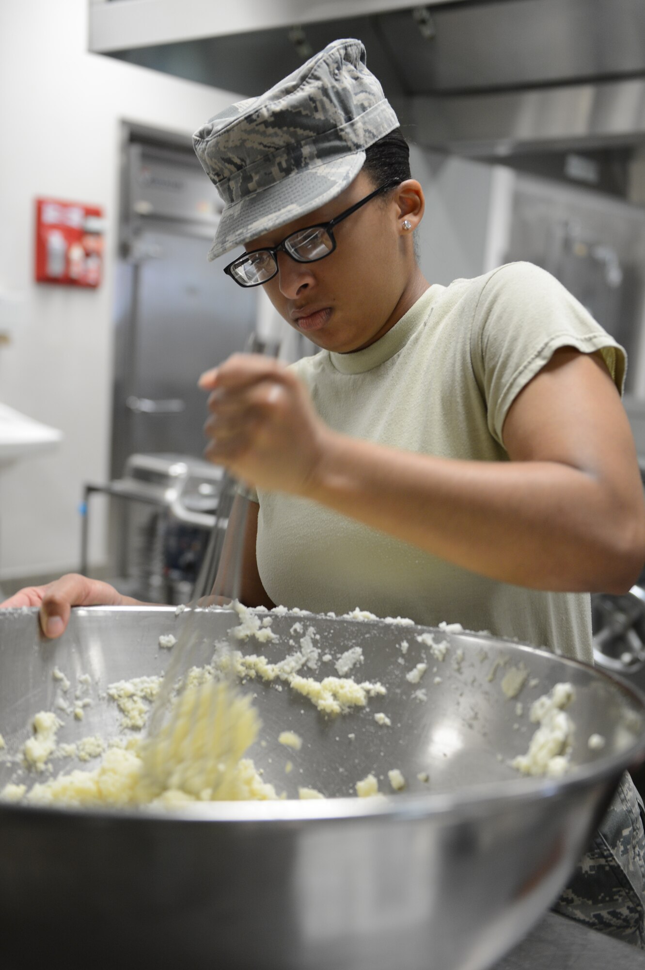 Airman 1st Class Mahoghamo Crews, 20th Force Support Squadron food services apprentice, makes mashed potatoes for lunch at the Chief Master Sgt. Emerson Williams Dining Facility at Shaw Air Force Base, July 11, 2013. Lunch preparation begins two hours prior to serving a meal. (U.S. Air Force photos by Airman 1st Class Krystal M. Jeffers/Released)