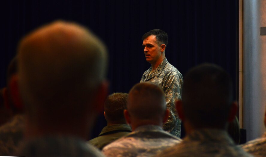 Col. Craig Wills, 39th Air Base Wing commander, speaks to members of the 39th Maintenance Group and 39th Operations Squadron during a commander’s call July 12, 2013, at Incirlik Air Base, Turkey. This commander’s call was one of four where Wills discussed his expectations, vision and priorities with the wing. (U.S. Air Force photo by Staff Sgt. Eric Summers Jr./Released)