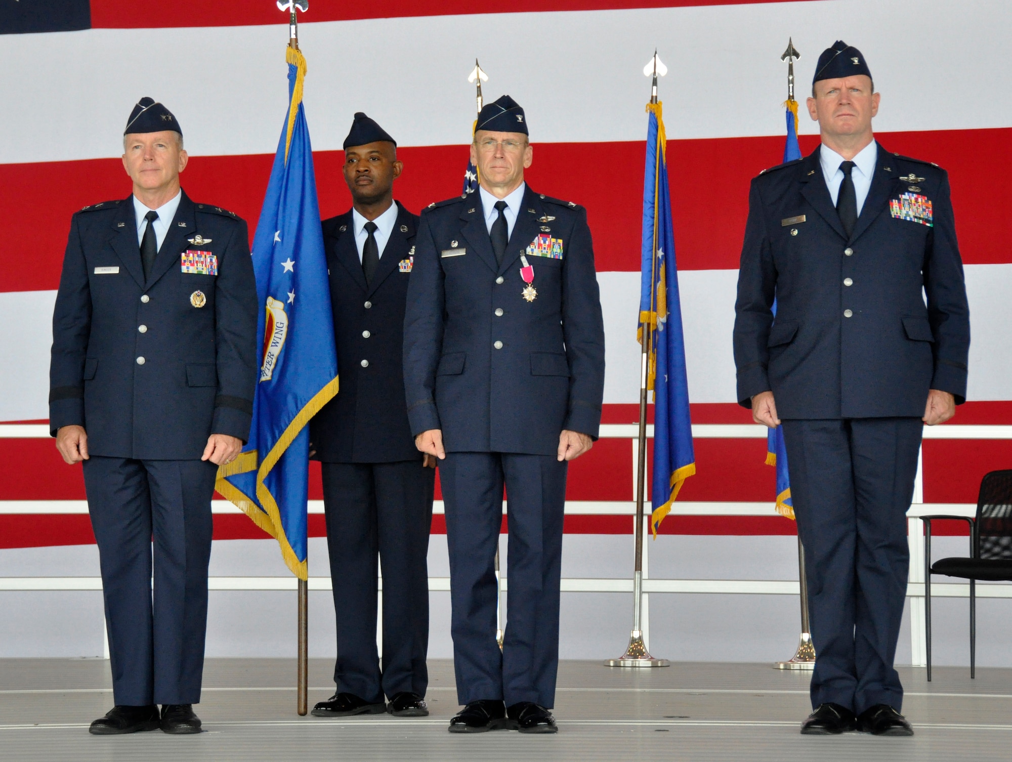 From left: Maj. Gen. William B. Binger, 10th Air Force commander, Chief Master Sgt. Cameron Kirksey, Air Force Reserve Command command chief master sergeant, Col. Donald R. Lindberg, new 10th AF vice commander, and Col. Christian G. Funk, new 482nd Fighter Wing commander, stand at attention during the 482nd FW change of command ceremony at Homestead Air Reserve Base, Fla., July 14. (U.S. Air Force photo/Senior Airman Nicholas Caceres)