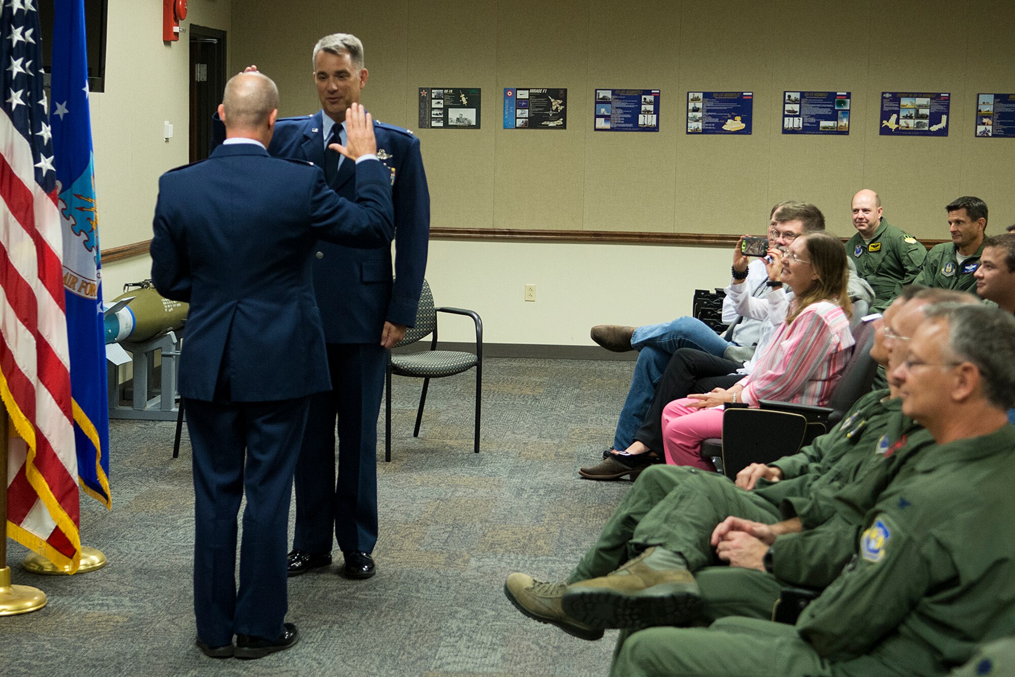 Family, friends and co-workers attend a Pinning On ceremony for U.S. Air Force Col. Dave Leedom, July 12, 2013, Barksdale Air Force Base, La. Leedom is the former commander of the 93rd Bomb Squadron, 307th Bomb Wing, and was recently promoted to the rank of Colonel. (U.S. Air Force photo by Master Sgt. Greg Steele/Released)