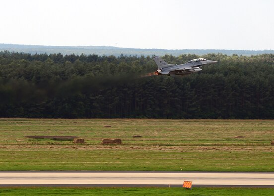 LASK AIR BASE, Poland -- A U.S. Air Force F-16 Fighting Falcon fighter aircraft from Aviano Air Base, Italy, launches during a training mission July 16, 2013. Detachment 1, 52nd Operations Group is an American training presence in Poland that works with Polish military leadership to organize four aircraft rotations a year. (U.S. Air Force photo by Staff Sgt. Daryl Knee/Released)