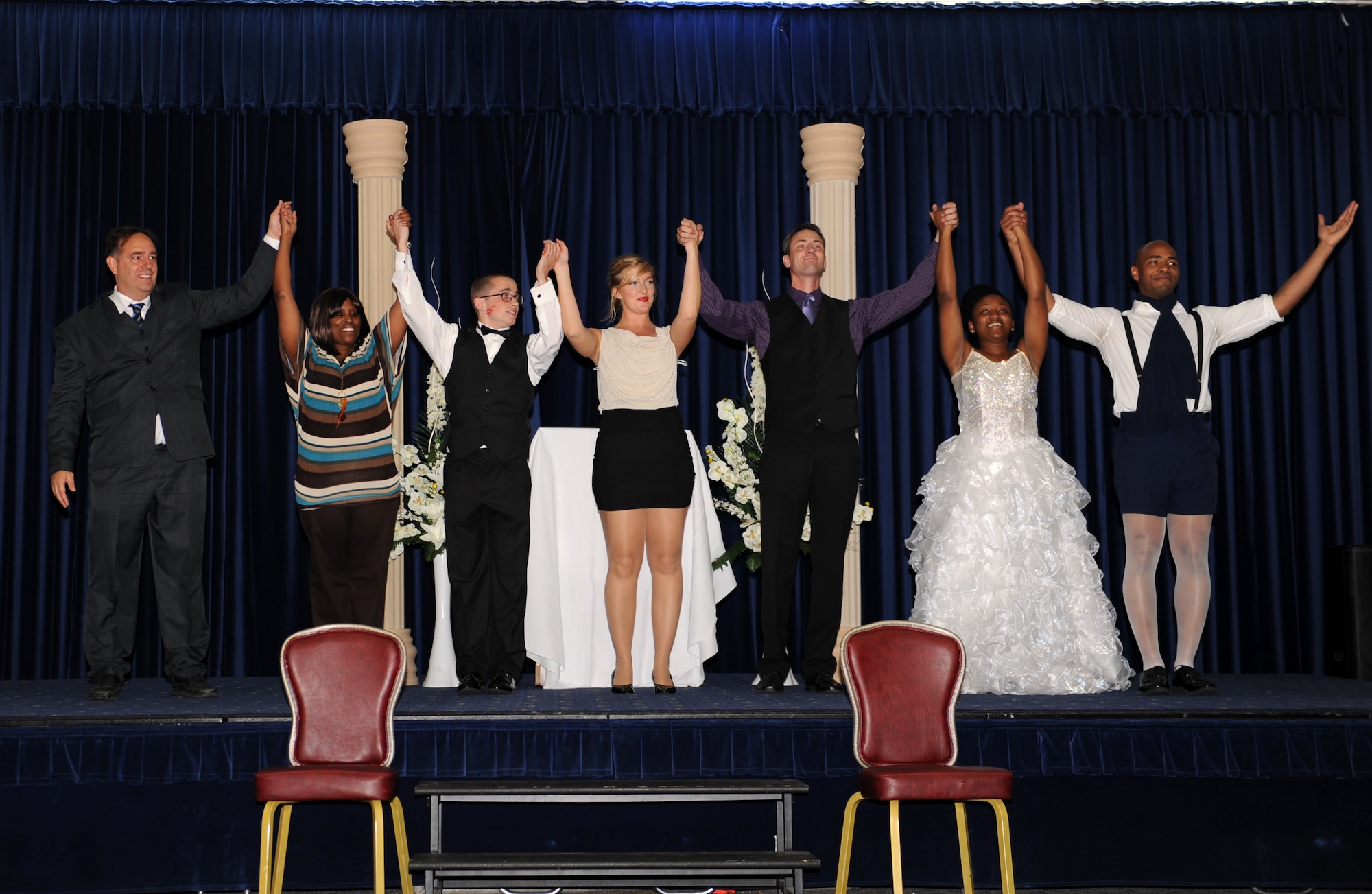 The cast of the Incirlik actors performance of Marriage Can Be Murder prepare to take a bow after their debut on July 11, 2013, at Incirlik Air Base, Turkey. The Consolidated Club Complex, community center and a cast and crew of 10 Airmen from across the installation came together worked for eight weeks to plan for and rehearse the show. (U.S. Air Force photo by Senior Airman Chase Hedrick/Released)
