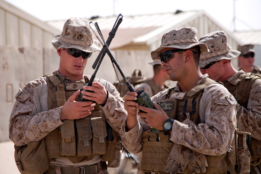 U.S. Marines prepare their radios before conducting mission rehearsals on Camp Leatherneck in Afghanistan's Helmand province, July 10, 2013.