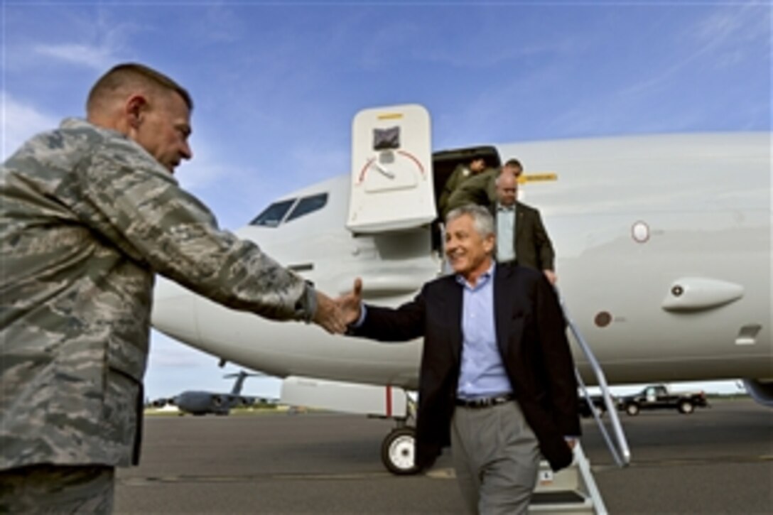 Air Force Col. Richard D. McComb, commander of the 628th Air Base Wing, welcomes Defense Secretary Chuck Hagel to Joint Base Charleston, S.C., July 16, 2013.