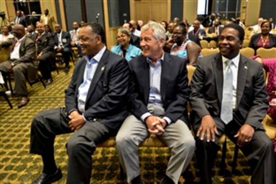 Defense Secretary Chuck Hagel, center, takes a moment to sit with the Rev. Jesse L. Jackson Sr., left, and Jacksonville, Fla., Mayor Alvin Brown during a conference of minority transportation officials before leaving his hotel to visit Naval Air Station Jacksonville, July 16, 2013. Hagel is on a three-day trip to visit several bases to get feedback from troops.