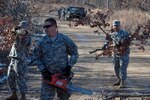 The Arkansas Guard has about 1,000 troops supporting civil authorities across the state. Several of the Soldiers, many of whom just recently returned from Iraq with the 39th Infantry Brigade Combat Team, spent their day clearing debris from the roadways in Marmaduke, Ark., with chainsaws and muscle.