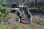 Soldiers from Company B, 1st Battalion, 128th Infantry Regiment, 32nd Infantry Brigade Combat Team dismount from their vehicle during a convoy training exercise at Camp Blanding Joint Training Center in Florida. The 32nd is conducting training in preparation for an upcoming deployment to Iraq.