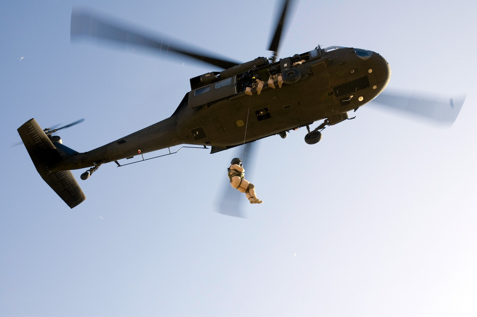 Soldiers of Company A 1-168th Aviation perform hoist training on a UH-60 Blackhawk at Gowen Field on September 16, 2008. The hoist was recently installed on the UH-60 and will be used during emergency rescues for the units state mission.