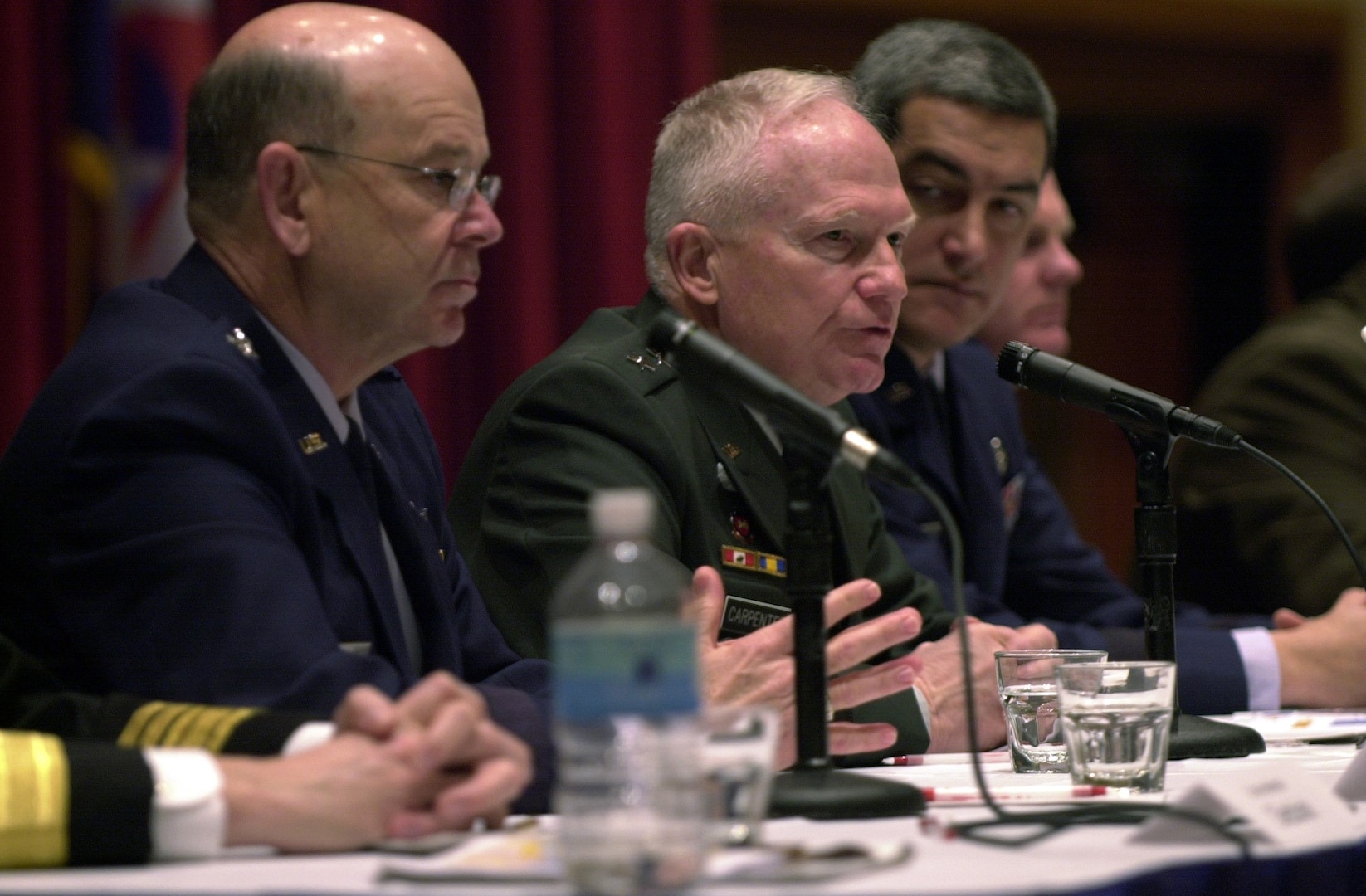 Maj. Gen. Raymond W. Carpenter, special assistant to the director of the Army National Guard, talks about the effectiveness of the Guard's Agriculture Development Teams in Afghanistan at the reserve component chief's panel discussion at the Reserve Officers Association's Annual Mid-winter Conference and Reserve Component Expo Feb. 3 at the Marriott Wardman Park Hotel in Washington. He's flanked by Maj. Gen. Emmett R. Titshaw Jr. (left) of the Air National Guard.; and Maj. Gen. Kelly K. McKeague (right), chief of staff at the National Guard Bureau.
