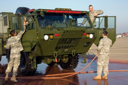 Pfc. Ryan Rovito and his crew from the 233rd Engineer Fire Fighting Team take pride in detailing the Heavy Expanded Mobility Tactical Truck (HEMTT) based Water Tenders (HEWATT) in preparation for the California National Guard press conference highlighting the newly acquired enhanced firefighting capabilities, January 30, 2009.