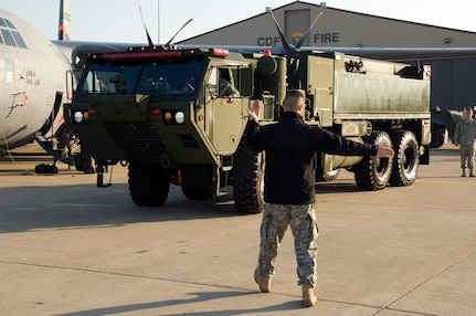 The 233rd Engineer Fire Fighting team rolls into McClellan Air Park, Calif. to showcase newly acquired High-Mobility Water Tenders (HEWATT) during a press conference held by the California National Guard January 30, 2009.