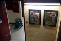 Two memorials are posted of Cpl. Christopher M. Monahan Jr. (right), and Lance Cpl. Dale W. Means (left), motor transportation operators with Transportation and Support Company, Combat Logistics Battalion 2, 2nd Marine Logistics Group, at the company motor pool aboard Camp Lejeune, N.C., July 15, 2013. Memorials of Means and Monahan were posted for display at the TS Co. barracks and motor pool for the Marines to see every day. 