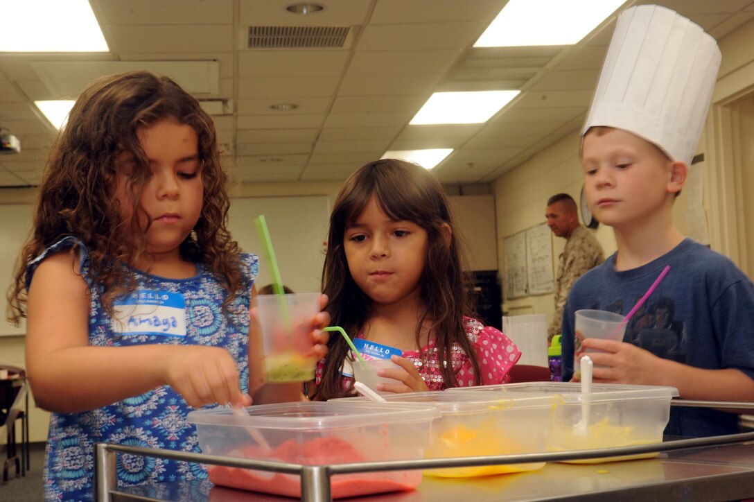 Children make smoothies during a class at the Barber Physical Fitness Center on July 16, 2013. The class, Kids in the Kitchen, was hosted by Semper Fit and Families Overcoming Under Stress and taught children about stress using food.