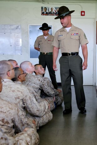 Staff Sgt. Ricky Broadway, senior drill instructor, Company G, 2nd Recruit Training Battalion, speaks to his new recruits aboard Marine Corps Recruit Depot San Diego July 12. It was the first time the recruits met the drill instructors that will train them for the next three months.