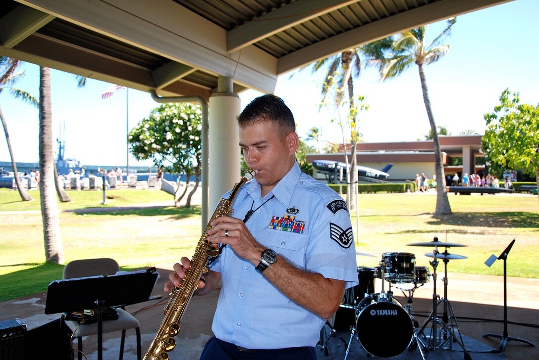 SSgt Miles Hudlow solos on the soprano saxophone. 