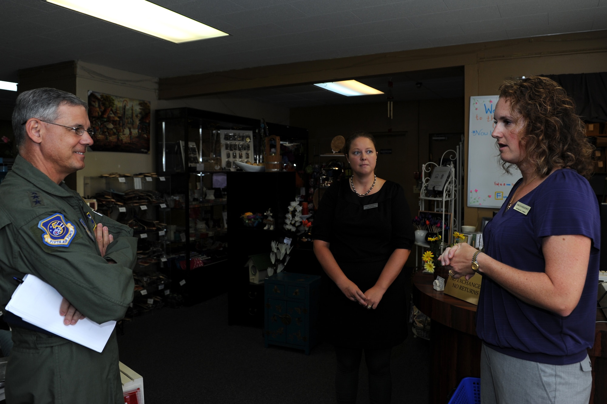 U.S. Air Force Lt. Gen. Sam Angelella, U.S. Forces Japan and 5th Air Force commander, receives a brief from volunteers at the Kadena Gift Corner on Kadena Air Base, Japan, July 11, 2013. Volunteers fly around the world to bring various gifts to sell at the gift corner and donate money to various American, military, Okinawan and Japanese welfare agencies, charities and organizations. (U.S. Air Force photo by Airman 1st Class Hailey R. Davis/Released)