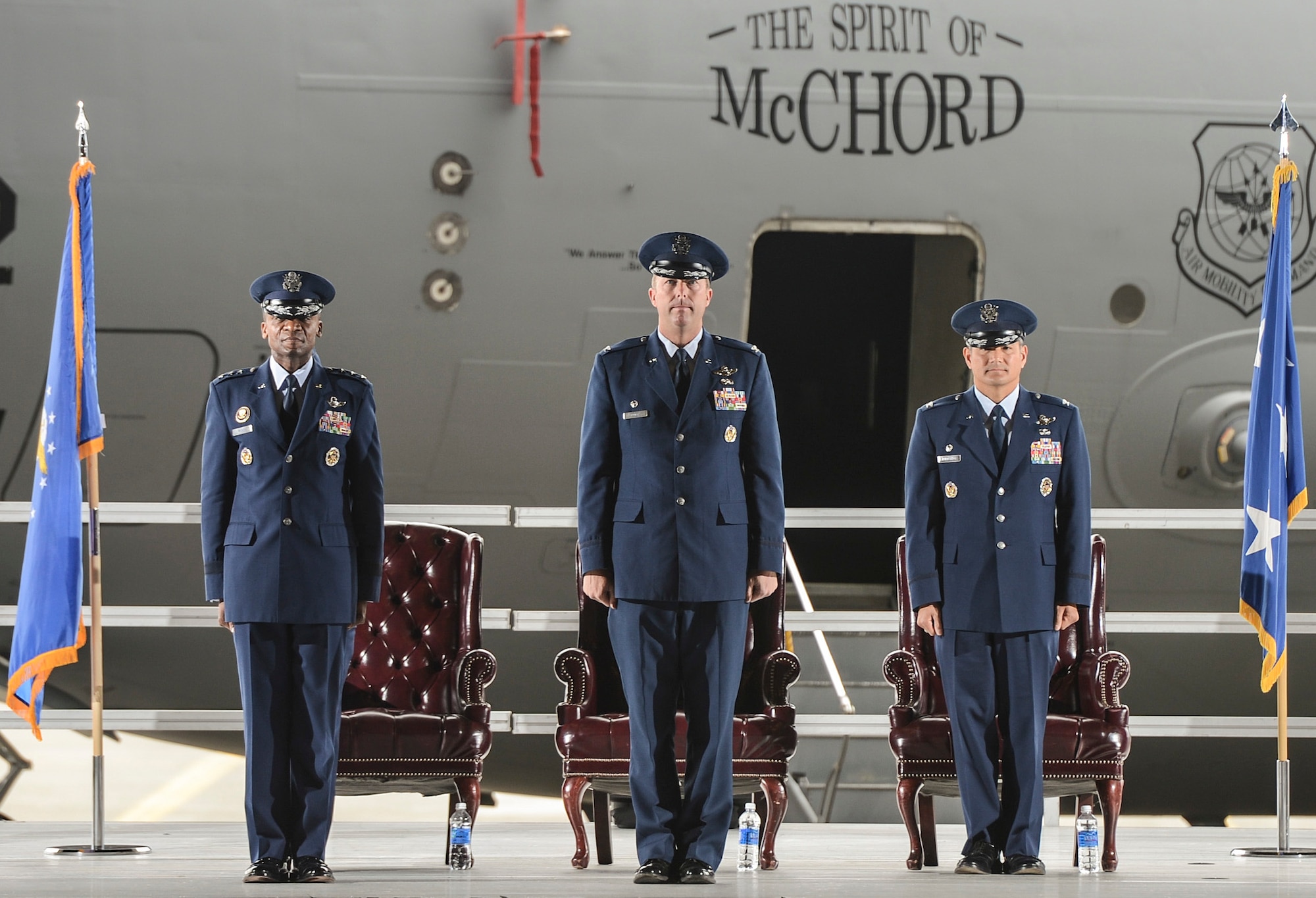 Lt. Gen. Darren McDew, 18th Air Force commander (left), Col. Wyn Elder, outgoing 62nd Airlift Wing commander (center), and Col. David Kumashiro, incoming 62nd AW commander (right), prepare for a change of command July 17, 2013 at Joint Base Lewis-McChord, Wash. Kumashiro assumed command of more than 2,300 active duty military and civilian personnel along with 48 permanently assigned C-17 Globemaster III aircraft, combined to support worldwide combat and humanitarian airlift.  (U.S. Air Force photo/Tech. Sgt. Sean Tobin)