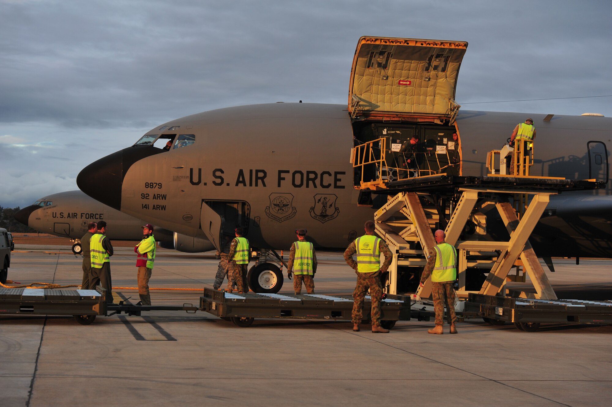 Airmen from the Royal Australian Air Force prepare for the U.S. Air Force KC-135 Stratotanker crew to deplane at RAAF Base Amberley, Australia, July 15, 2013. The KC-135s arrived from Kadena Air Base, Japan, to support Talisman Saber 2013, an exercise that helps participants foster and sustain cooperative international relationships that enhance regional security, stability and prosperity. (U.S. Air Force photo by Staff Sgt. Rachelle Coleman/Released)