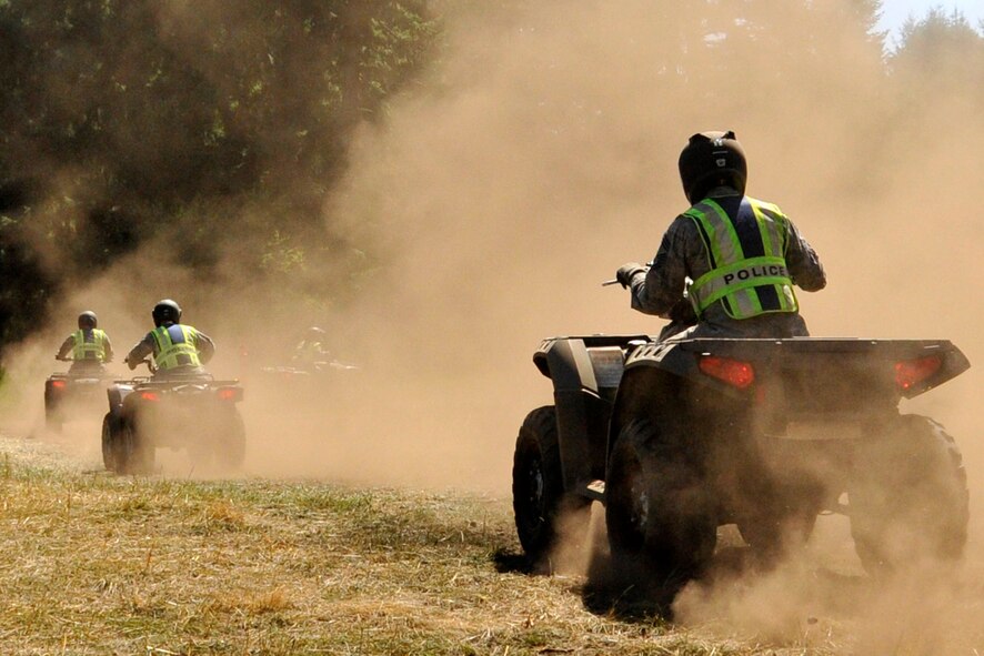 Airmen with the 446th Security Forces Squadron get a feel for all-terrain vehicles during the Reserve weekend, July 14, 2013. The Airmen were training to be certified in basic ATV riding. The ATV is one of the vehicles a security forces Airman might need in the field. For that reason, and because 446th SFS Reservists are deployable, they are required to take the ATV course every two to three years. Some of the 446th SFS Airmen have utilized those skills here at McChord Field to provide support for other security personnel, and incident response during major events, including air shows and Air Mobility Command Rodeo. (U.S. Air Force photo by Master Sgt. Jake Chappelle)