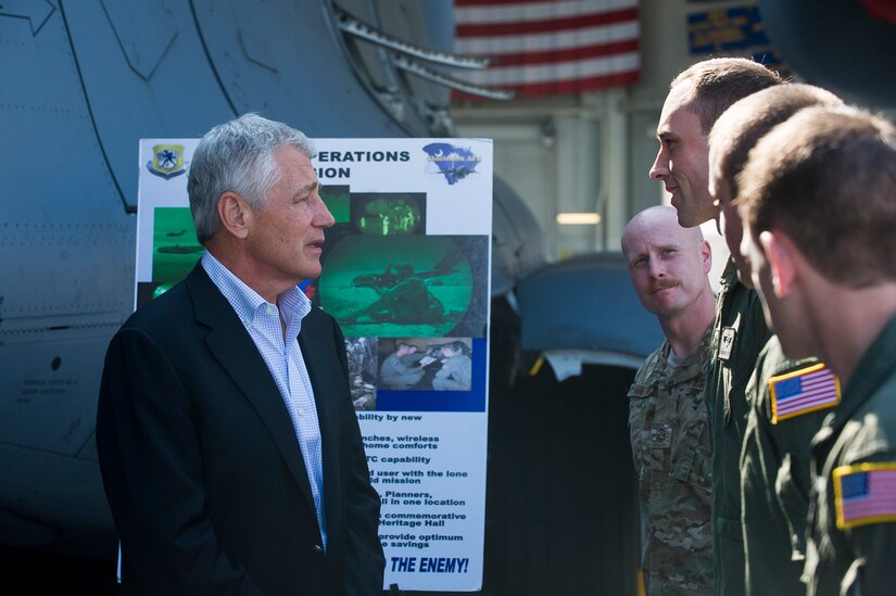 Secretary of Defense Chuck Hagel talks to members of the 437th Operations Group Special Operations Division about their mission July 17, 2013, at Joint Base Charleston- Air Base, S.C. Hagel is the 24th Secretary of Defense and the first enlisted combat veteran to lead the Department of Defense. Hagel’s visit to JB Charleston included briefings on flying and support operations conducted by the Air Force in Charleston, meeting with Boeing representatives about the company’s involvement with the Air Force, and conducting a town hall meeting with Department of Defense civilian employees to discuss the federal government’s sequestration and civilian work furloughs. (U.S. Air Force photo/ Senior Airman George Goslin)