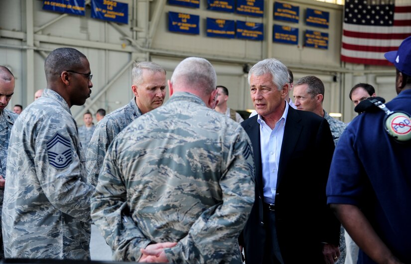 Chief Master Sgt. Rob Scarlett, 437th Aircraft Maintenance Squadron superintendent, briefs Secretary of Defense Chuck Hagel on the 437th AMXS mission during Joint Base Charleston – Air Base’s “Air Force showcase” July 17, 2013 during his visit to JB Charleston – Air Base, S.C. Hagel’s visit to JB Charleston included learning about flying and support operations conducted in the Air Force at Charleston, meeting with Boeing representatives to talk about what the company provides to the Air Force, and conducting a town hall meeting with Department of Defense civilian employees to discuss federal government sequestrations and civilian work furloughs in the department. (U.S. Air Force photo/Staff Sgt. Rasheen Douglas)