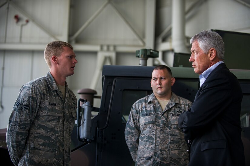 Senior Airman Robert Hardy, 628th Civil Engineer Squadron explosive ordinance disposal technician, briefs Secretary of Defense Chuck Hagel on EOD operations July 17, 2013, during a demonstration at Joint Base Charleston- Air Base, S.C. Hagel is the 24th Secretary of Defense and the first enlisted combat veteran to lead the Department of Defense. Hagel’s visit to JB Charleston included briefings on flying and support operations conducted by the Air Force in Charleston, meeting with Boeing representatives about the company’s involvement with the Air Force, and conducting a town hall meeting with Department of Defense civilian employees to discuss the federal government’s sequestration and civilian work furloughs. (U.S. Air Force photo/ Senior Airman George Goslin)