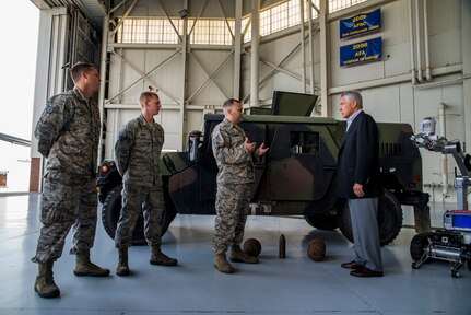 Secretary of Defense Chuck Hagel receives a brief from the 628th Civil Engineer Squadron explosive ordinance disposal flight July 17, 2013, during a demonstration at Joint Base Charleston- Air Base, S.C. Hagel is the 24th Secretary of Defense and the first enlisted combat veteran to lead the Department of Defense. Hagel’s visit to JB Charleston included briefings on flying and support operations conducted by the Air Force in Charleston, meeting with Boeing representatives about the company’s involvement with the Air Force, and conducting a town hall meeting with Department of Defense civilian employees to discuss the federal government’s sequestration and civilian work furloughs.  (U.S. Air Force photo/ Senior Airman George Goslin)