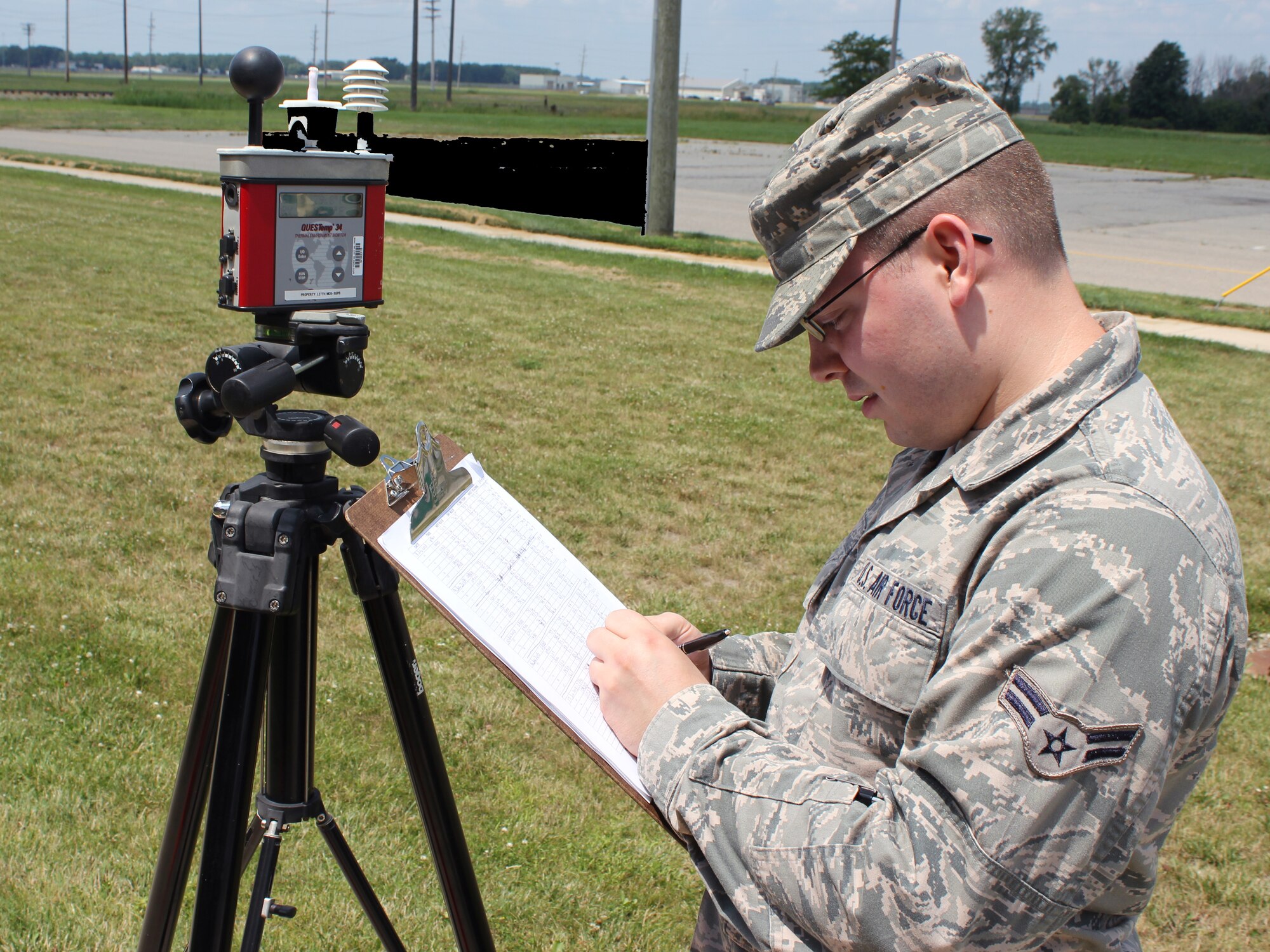 130717-Z-VA767-003 -- Airman 1st Class Brandon Reif takes a series of temperature readings at Selfridge Air National Guard Base, Mich., on July 17, 2013. The temperatures that day approached 90 degrees, the implementation point for a number of heat-related work/rest cycle precautions. (U.S. Air National Guard photo by TSgt. Dan Heaton / Released)