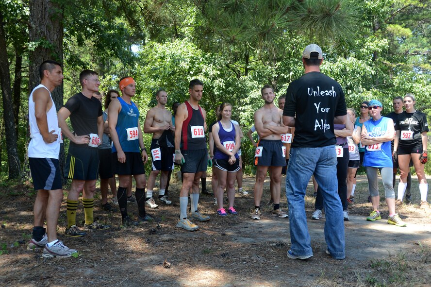 Michael Green, Chief of Operations for alphARace Inc., briefs the final runners before the championship wave during the alphARace at the East Reservation on Barksdale Air Force Base, La., July 13, 2013. The top three males and females from each wave both days of the race qualified for the final championship to win the alphARace trophies. (U.S. Air Force photo/Staff Sgt. Amber Corcoran)