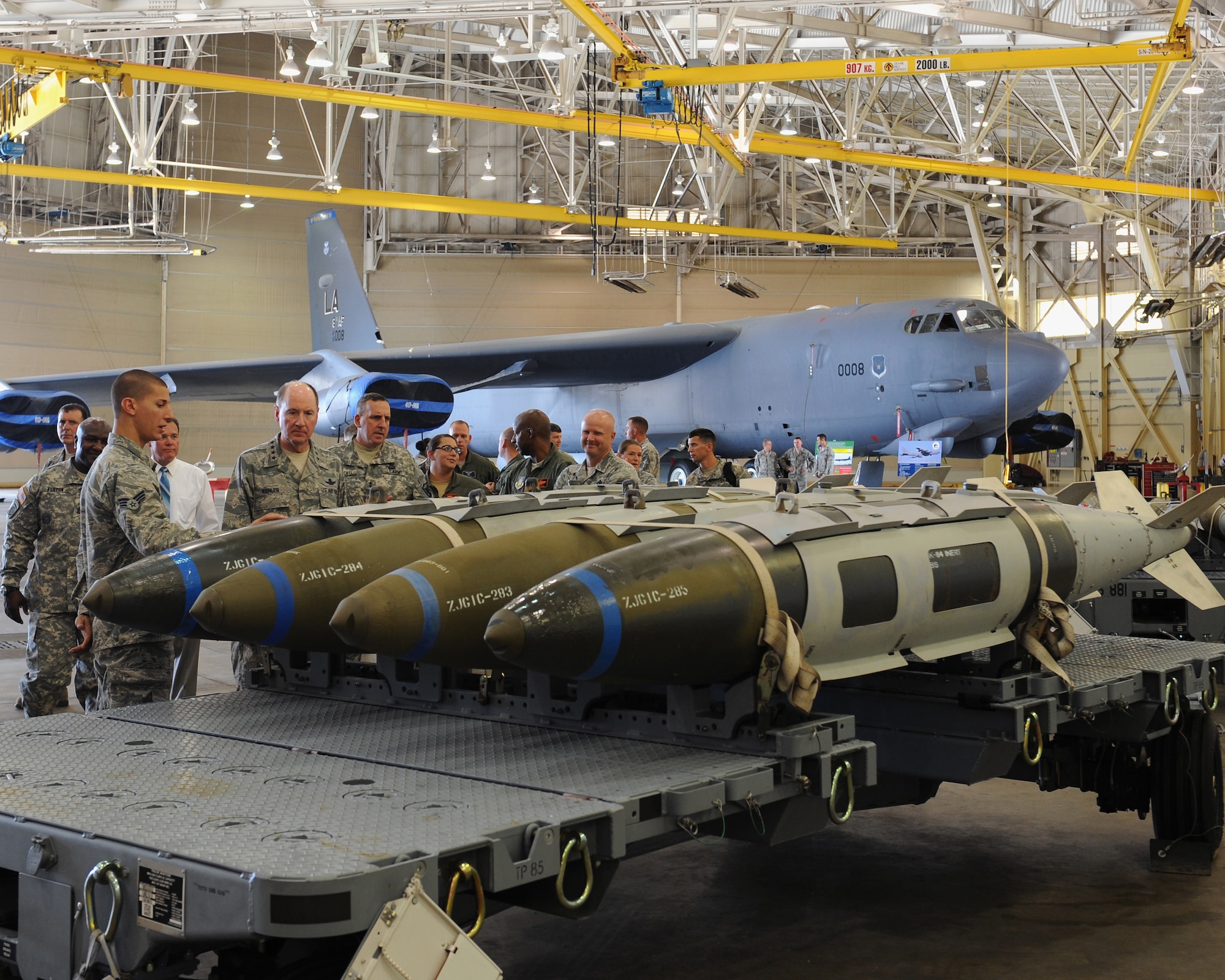 Senior Airman Gregory Quailer, 2nd Munitions Squadron, shows Gen. C. Robert Kehler, United States Strategic Command commander, GBU-31 Joint Direct Attack Munitions, which are used on the B-52H Stratofortress on Barksdale Air Force Base, La., July 15, 2013. Kehler received a static tour of the exterior and interior of a B-52 and a description of the type of munitions the aircraft may deploy. (U.S. Air Force photo/Airman 1st Class Benjamin Gonsier)   
