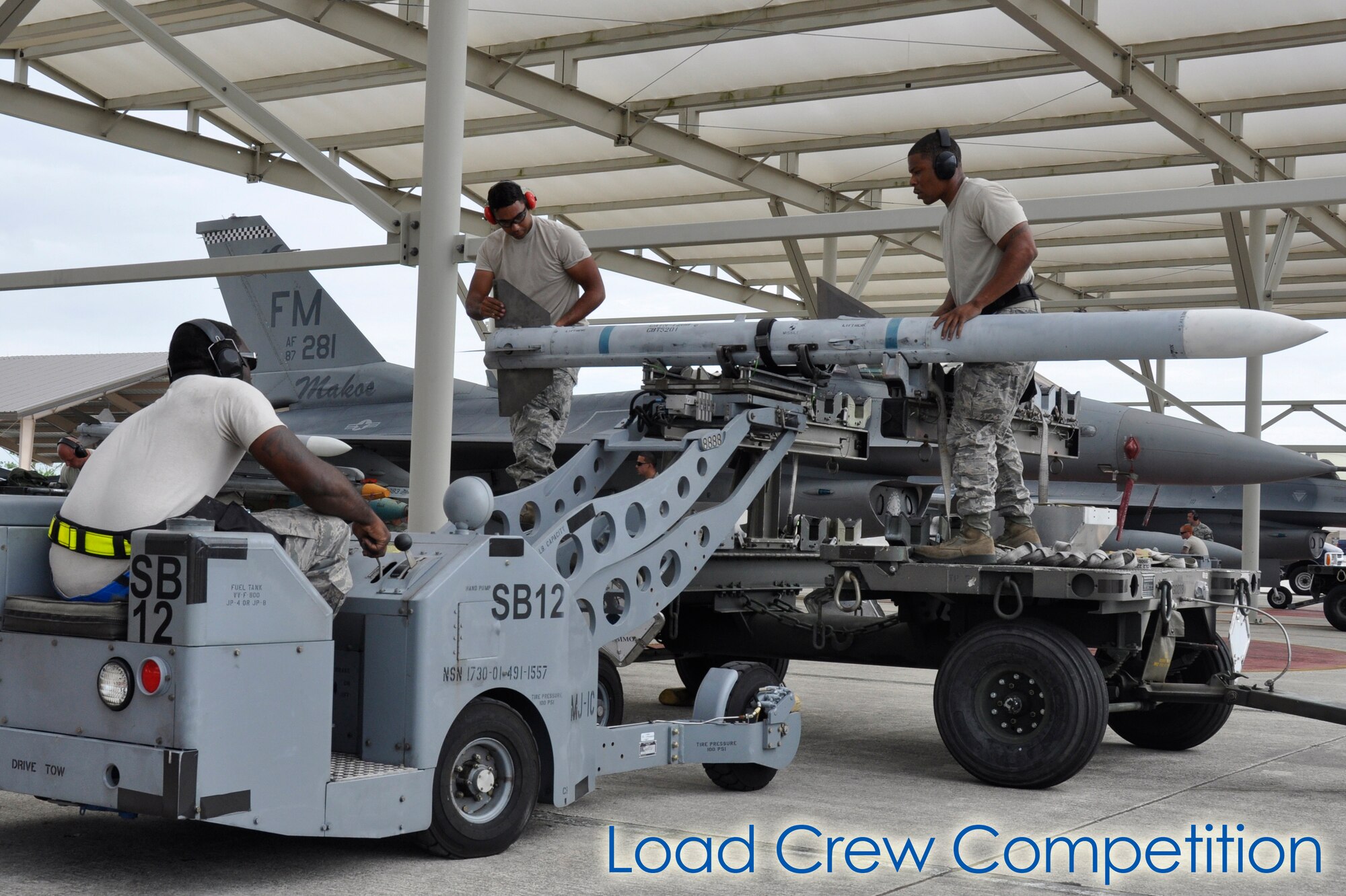 The 482nd Aircraft Maintenance Squadron held its quarterly Load Crew Competition here July 13. The load crews were evaluated in four areas to determine the winner: dress and appearance, tool kit inspection, a general knowledge test, and actual munitions loading to include speed and proficiency. The winners of this quarter’s competition were Staff Sgt. Danessa Gali, Senior Airman Stephen Hoffler, and Airman 1st Class William Ford, all of the 495th Fighter Group, Detachment 93. (U.S. Air Force photos/Senior Airman Nicholas Caceres)