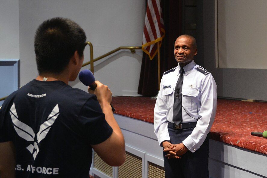 Lt. Gen. Darren McDew, 18th Air Force commander, answers a question from James Chan, Air Force Delayed Entry Program member, July 16, 2013 at Joint Base Lewis-McChord, Wash. McDew answered questions about topics such as tuition assistance, overcoming challenges and women in combat. (U.S. Air Force photo/Airman 1st Class Jacob Jimenez)   