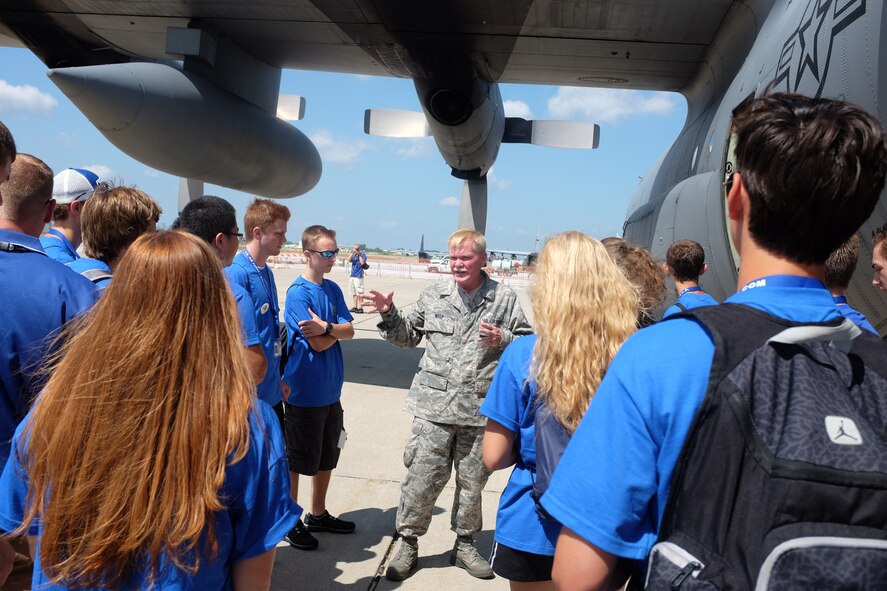 Chief Master Sgt. Ron Welp, 934th Aircraft Maintenance Squadron, talks about the C-130 aircraft with students from the Minnesota Aviation Career Education Camp July 16. ACE camp is sponsored by the Minnesota Dept. of Transportation and Federal Aviation Administration and offers two week-long camps for high school age students interested in aviation careers.(Air Force Photo/Paul Zadach)