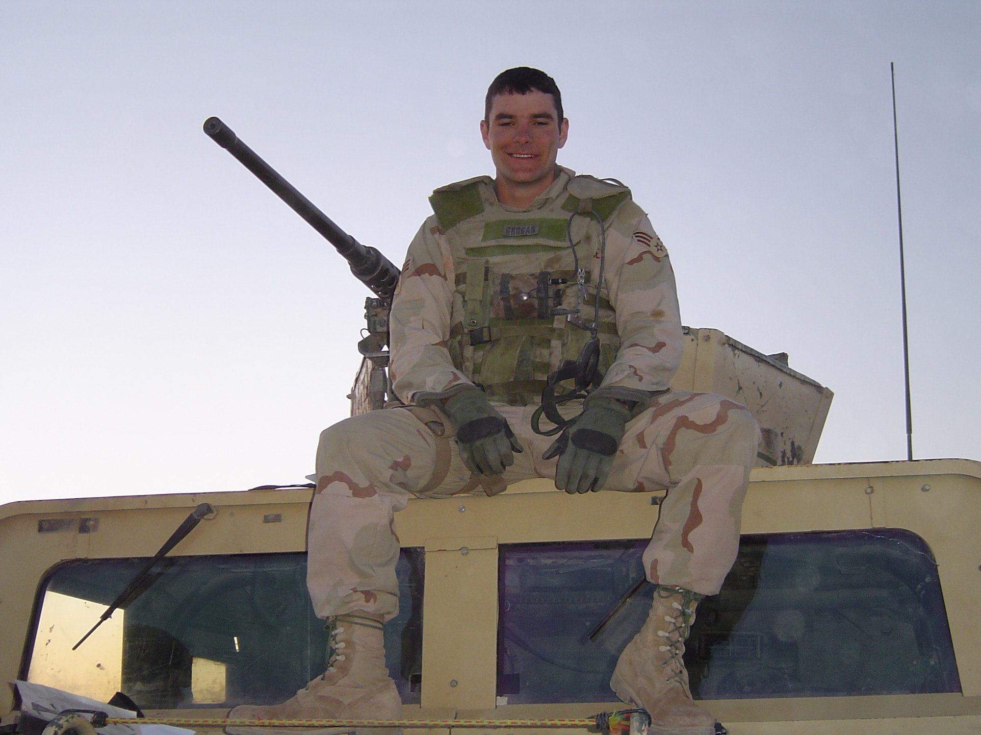 Tech. Sgt. Kellen Grogan, then a senior Airman, sits on a Humvee in Iraq March 21, 2005, just two days after suffering a concussion from an improvised explosive device detonating underneath his vehicle. (courtesy photo)