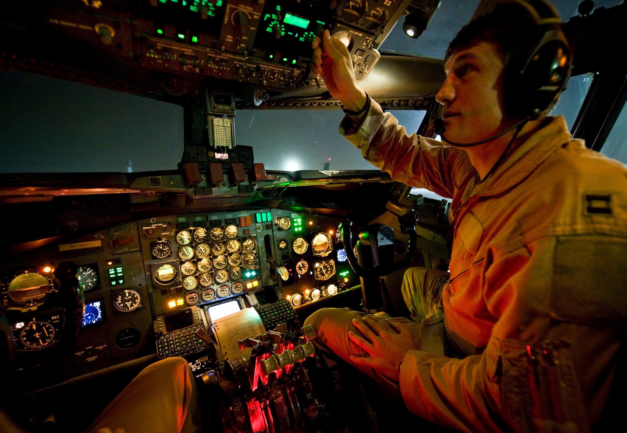 Capt. Jared runs through pre-flight checks onboard an E-8C Joint Surveillance Target Attack Radar System at the 379th Air Expeditionary Wing in Southwest Asia, July 11, 2013. Jared is a 7th Expeditionary Airborne Command and Control Squadron pilot. (U.S. Air Force photo/Senior Airman Benjamin Stratton)