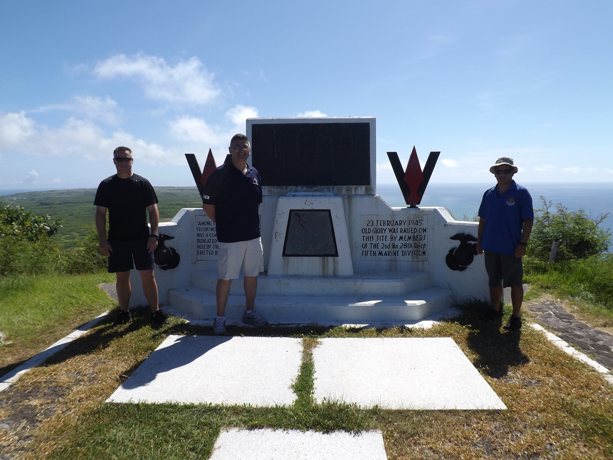 From left to right: Chief Master Sgts. Jason Williams, 374th Operations Support Squadron air traffic control superintendent; Manuel Roblesreynoso, 374th Airlift Wing command chief and Rick Ramos, 515th Air Mobility Operations Group command chief, stand in front of the Mount Suribachi memorial at Iwoto, Japan, June 20, 2013. Suribachi is the place where Marines raised the U.S. flag and the renowned Pulitzer Prize-winning photo was shot by Joe Rosenthal. (Courtesy photo) 