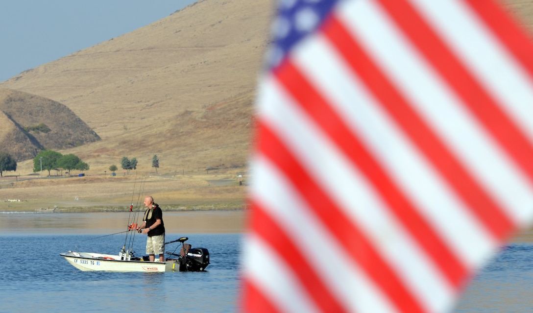 A bass fisherman casts a line at Success Lake, a U.S. Army Corps of Engineers project near Porterville, Calif.