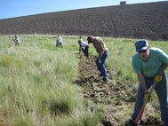 National Trails Day 2011 volunteers clearing a trail in order to re-route a badly eroding trail at Bennington Lake.