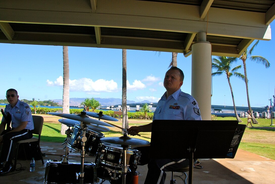 SSgt Troy Griffin plays on the drum set during the Papana concert on the 17th of July. 