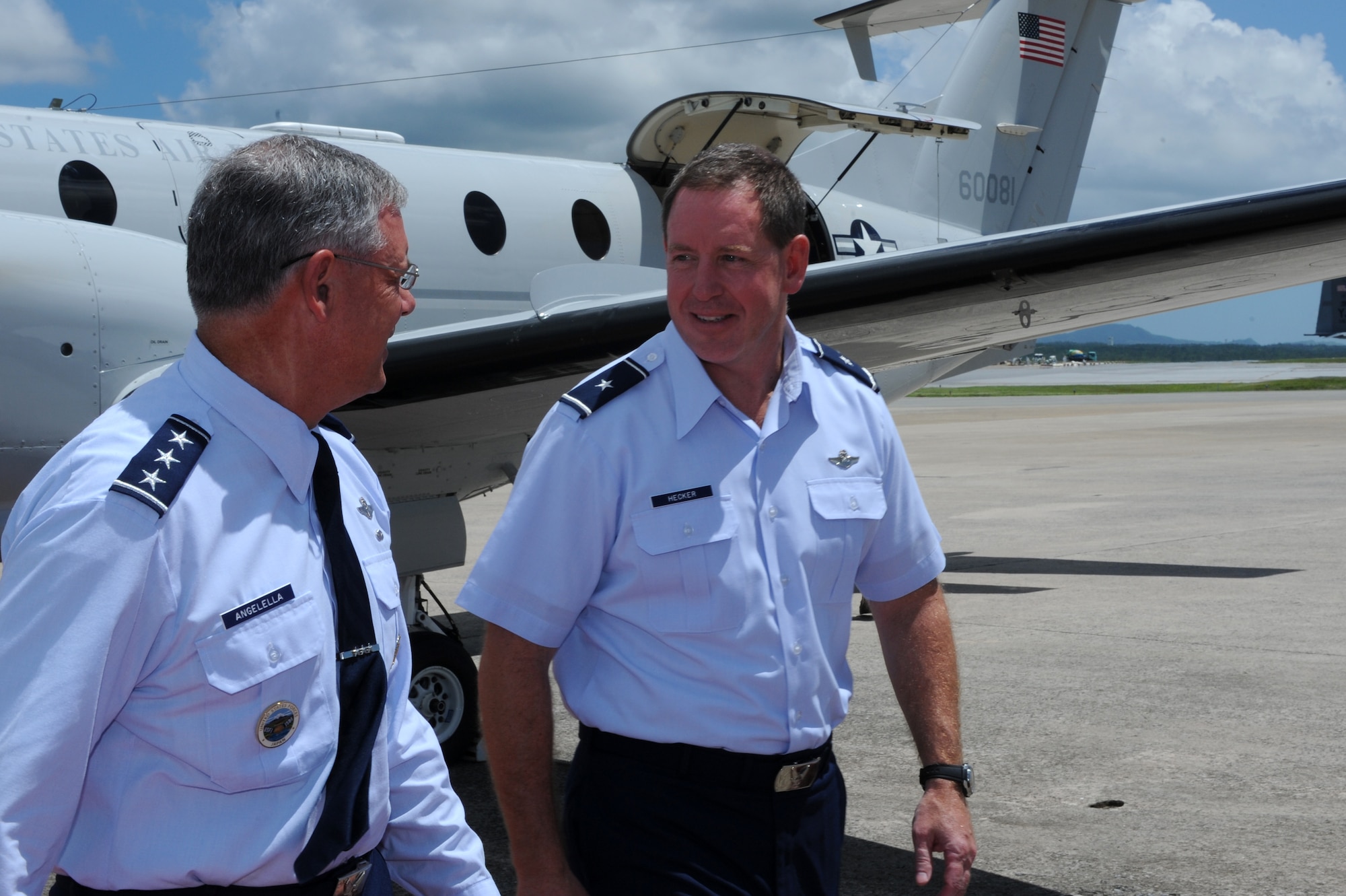 U.S. Air Force Lt. Gen. Sam Angelella, U.S. Forces Japan and 5th Air Force commander, walks with Brig. Gen. James Hecker, 18th Wing commander, on Kadena Air Base, Japan, July 10, 2013. Angelella visited different units and facilities on Kadena, such as the only operational cryogenics laboratory in the Air Force and visited the U.S. Naval Hospital Okinawa on Camp Foster. (U.S. Air Force photo by Airman 1st Class Hailey R. Davis/Released)