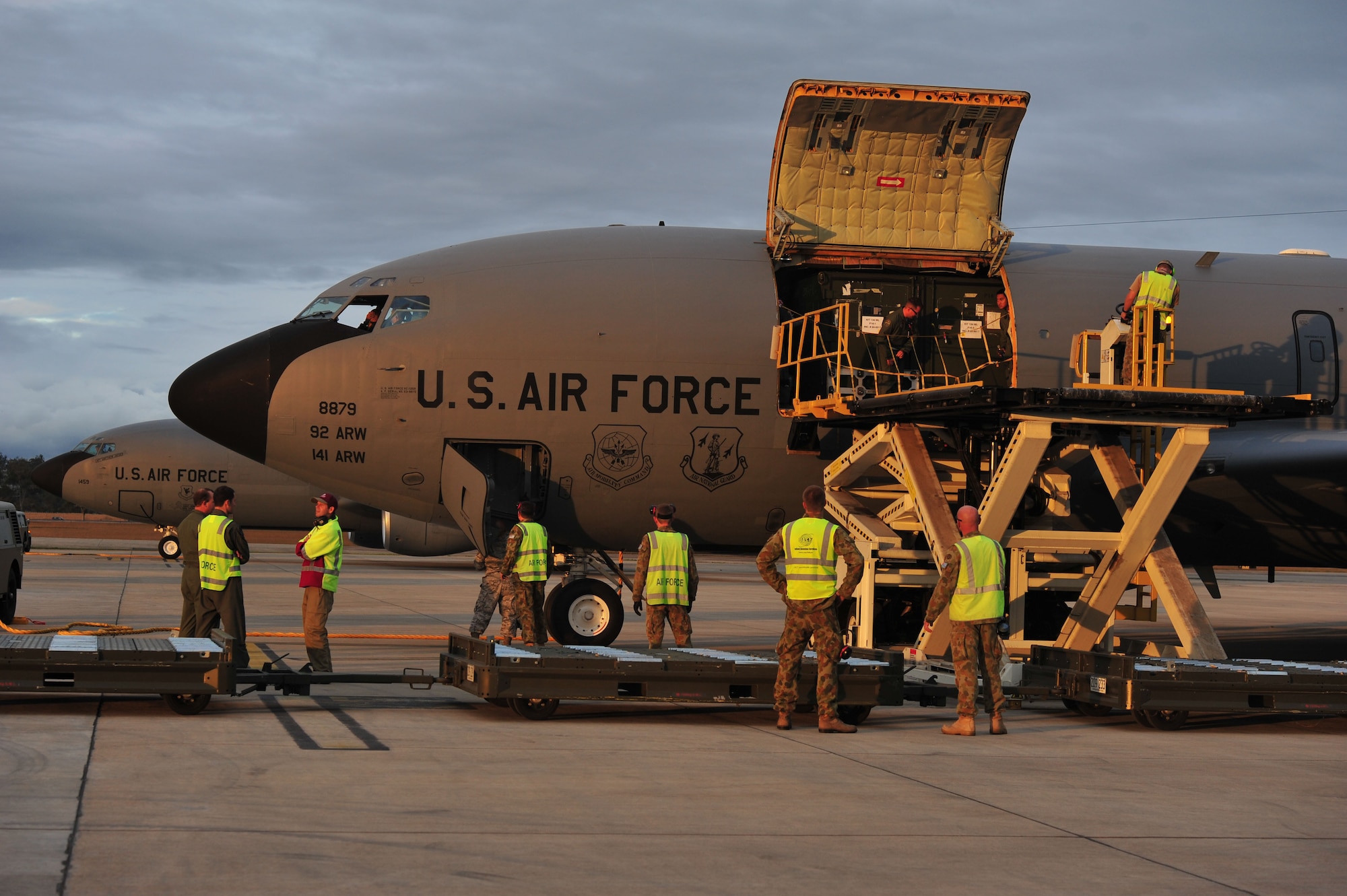 Airmen from the Royal Australian Air Force prepare for the U.S. Air Force KC-135 Stratotanker crew to deplane at RAAF Base Amberley, Australia, July 15, 2013. The KC-135s arrived from Kadena Air Base, Japan, to support Talisman Saber 2013, an exercise that helps participants foster and sustain cooperative international relationships that enhance regional security, stability and prosperity. (U.S. Air Force photo by Staff Sgt. Rachelle Coleman/Released)