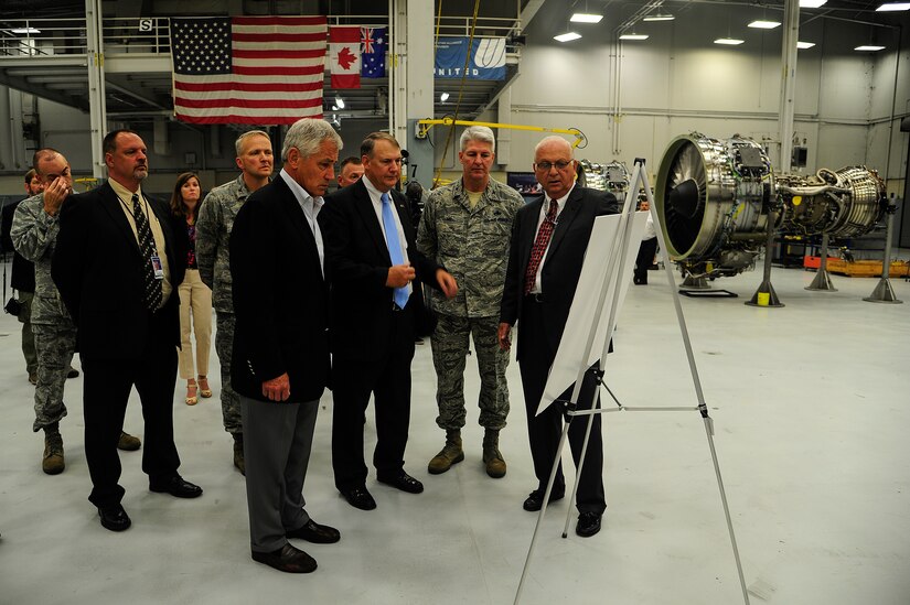 John Cook, Boeing Field Services director, briefs Secretary of Defense Chuck Hagel on the day to day operations that occur at the Boeing Modular Repair and Test Center, July 17, 2013, at Joint Base Charleston – Air Base, S.C. Hagel’s visit to JB Charleston included learning about flying and support operations conducted in the Air Force at Charleston, meeting with Boeing representatives to talk about what the company provides to the Air Force, and conducting a town hall meeting with Department of Defense civilian employees to discuss federal government sequestrations and civilian work furloughs in the department. (U.S. Air Force photo/Staff Sgt. Rasheen Douglas)