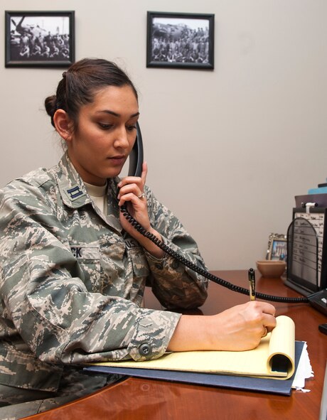 U.S. Air Force Capt. Kristen Beck, Air Force Legal Operations Agency Special Victims’ Counsel (SVC), talks to a sexual assault victim on the phone at Moody Air Force Base, Ga., July 16, 2013. SVCs are experienced attorneys assigned to the victim to protect their rights and offer legal advice during a trial. (U.S. Air Force photo by Senior Airman Jarrod Grammel/Released)

